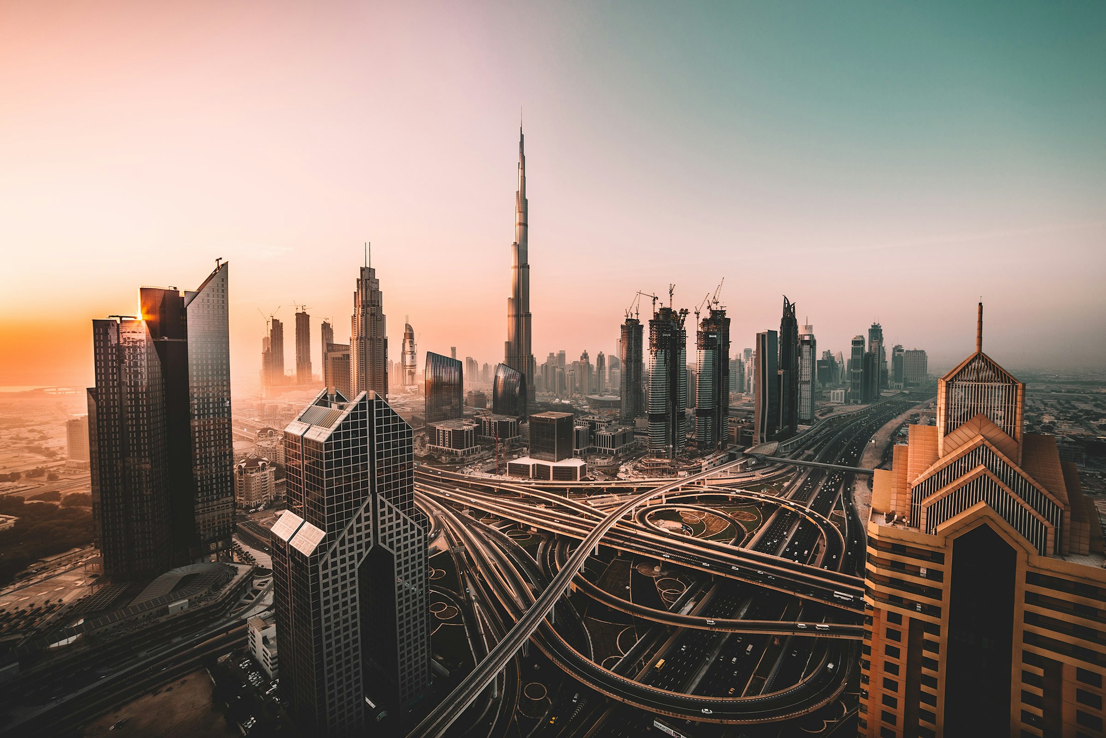 Dubai skyline and Burj Khalifa in the warm light of sunset